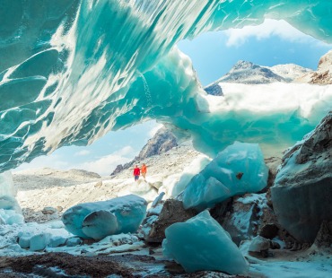 Frozen Glacier with people viewing in the background Frozen Glacier with people viewing in the background