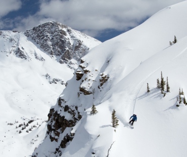 Snowboarder shredding in deep back country powder Snowboarder shredding in deep back country powder