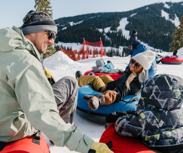 Family enjoying the tube park at Sun Peaks Family enjoying the tube park at Sun Peaks