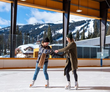 People skating on the ice rink in Sun Peaks People skating on the ice rink in Sun Peaks