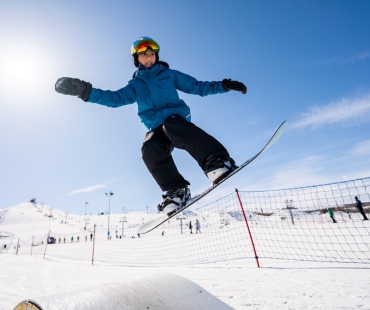 Snowboarder jumping at WinSport Calgary Snowboarder jumping at WinSport Calgary