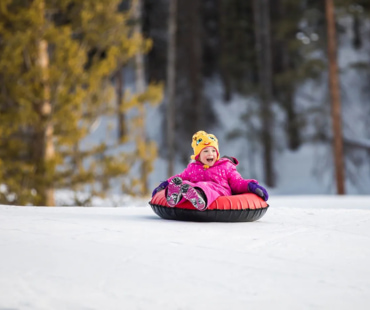 Child enjoying Tubing at Aspen Child enjoying Tubing at Aspen