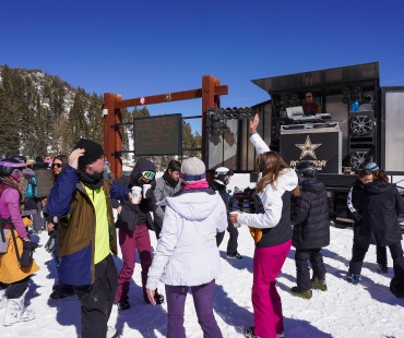 People dancing to the DJ on the mountain People dancing to the DJ on the mountain