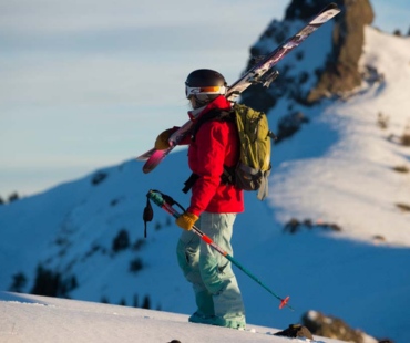 Stunning views and skier hiking the mountain backcountry Stunning views and skier hiking the mountain backcountry