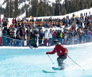 Skier gliding across water at slush cup event Skier gliding across water at slush cup event