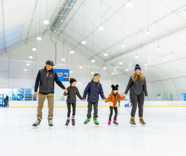 Family ice skating in mammoth Family ice skating in mammoth