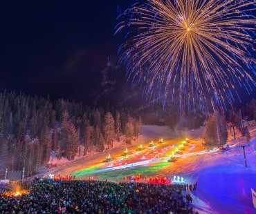 Fireworks and torch lit lights along the slopes Fireworks and torch lit lights along the slopes