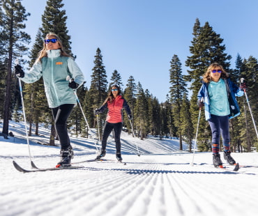 3 people on the nordic trails cross country skiing 3 people on the nordic trails cross country skiing