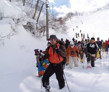 People taking a guided snowshoe tour People taking a guided snowshoe tour