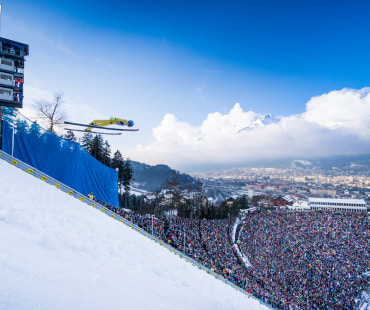 Skier jumping at the ski jump Skier jumping at the ski jump