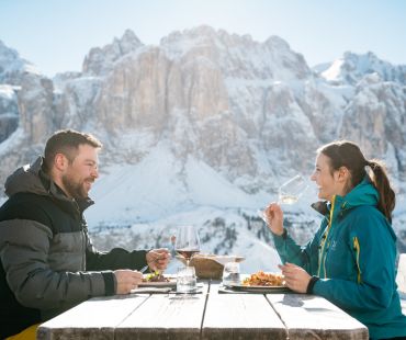 Couple enjoying gourmet meal with mountain views Couple enjoying gourmet meal with mountain views