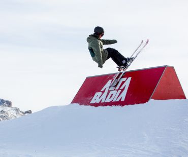 Skier doing tricks on Alta Badia Snowpark obstacle Skier doing tricks on Alta Badia Snowpark obstacle