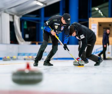 People curling on the ice People curling on the ice