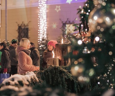 People enjoying lit up christmas activities People enjoying lit up christmas activities