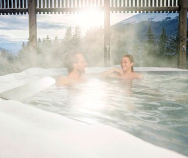 people relaxing in steamy pool people relaxing in steamy pool