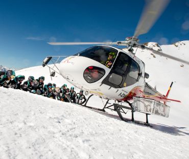 Helicopter and tour goers on the glacier Helicopter and tour goers on the glacier