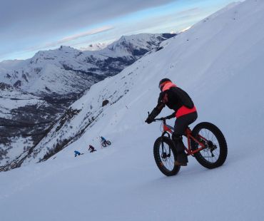 Person riding fat bike on snowy trails Person riding fat bike on snowy trails
