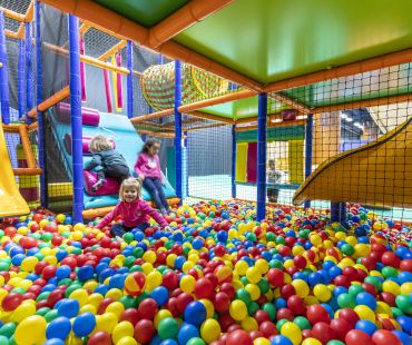 Kids playing in the ball pit Kids playing in the ball pit