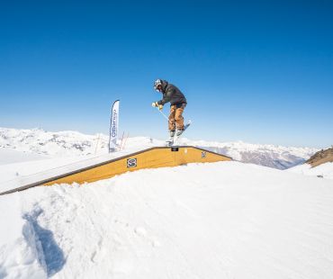 Rider sliding on rails at the snow park Rider sliding on rails at the snow park