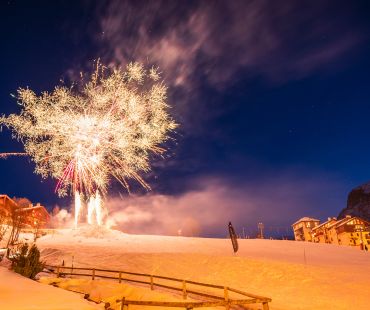Fireworks lighting up the ski hill at night Fireworks lighting up the ski hill at night