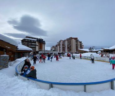 People enjoying the ice skating on the ice rink People enjoying the ice skating on the ice rink