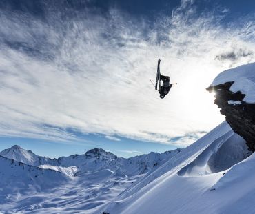 Skier flipping off cliff Skier flipping off cliff