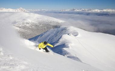 Snowboarder at the Peak of Marmot Basin